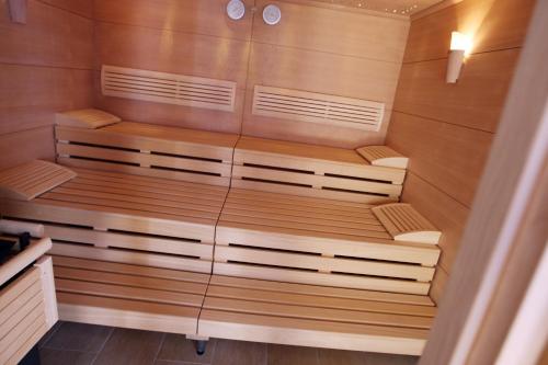 a sauna with wooden walls and wooden shelves at Perbersdorfer Heuriger in Neuhofen an der Ybbs