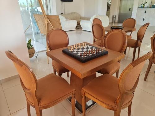 a chess board on a wooden table in a living room at Chateau de Georges in Gythio