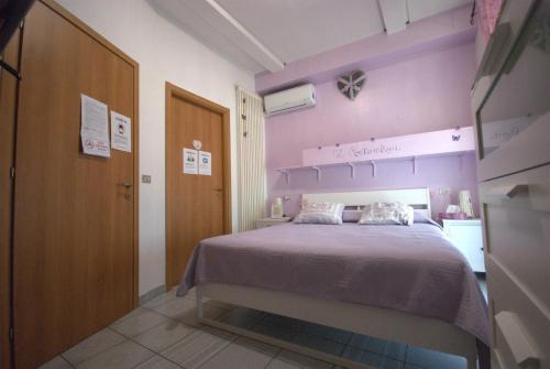 Ένα ή περισσότερα κρεβάτια σε δωμάτιο στο B&B Vittorio Emanuele