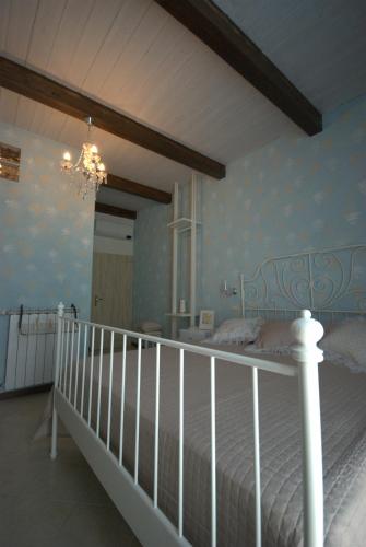Ένα ή περισσότερα κρεβάτια σε δωμάτιο στο B&B Vittorio Emanuele