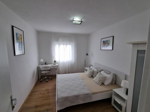 Posteľ alebo postele v izbe v ubytovaní Apartmani Mali