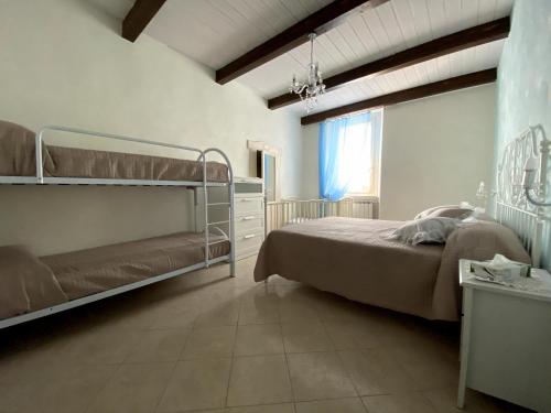Ένα ή περισσότερα κρεβάτια σε δωμάτιο στο B&B Vittorio Emanuele