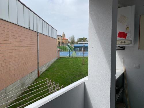 a view of a tennis court from the side of a building at Apartamento Bella Vista in Suances