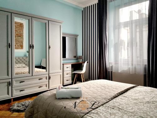 Posteľ alebo postele v izbe v ubytovaní Apartament Peowiaków Superior