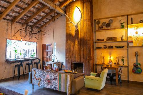 a living room with a couch and a fireplace at Pura Vida Mae YerbaBuena in Yerba Buena