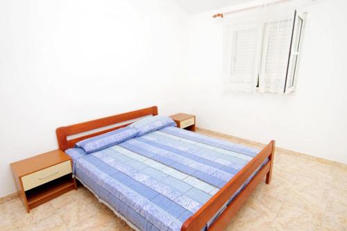 Ένα ή περισσότερα κρεβάτια σε δωμάτιο στο Seaside secluded apartments Cove Jedra, Hvar - 2583