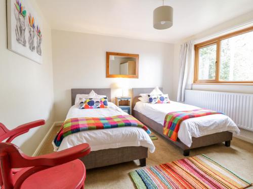 Un pat sau paturi într-o cameră la Groes Lwyd