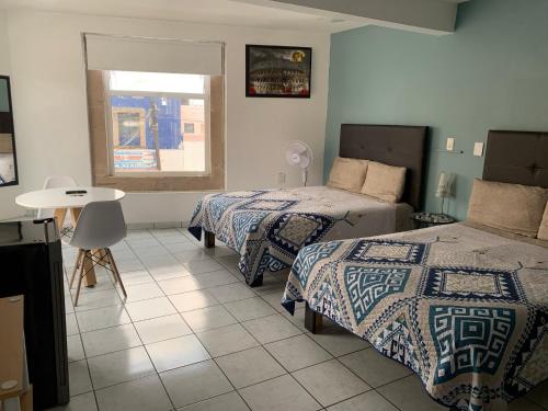 Ένα ή περισσότερα κρεβάτια σε δωμάτιο στο ESPACiOS RAYON
