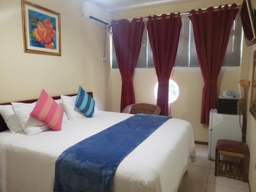 Postel nebo postele na pokoji v ubytování Sea Shell Palms, Ocho Rios