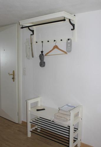 a white room with a shelf and a white table at Unterkunft "Rathaus" Altstadt, Rheinfelden Schweiz in Rheinfelden
