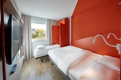 Postel nebo postele na pokoji v ubytování ibis budget Bayreuth