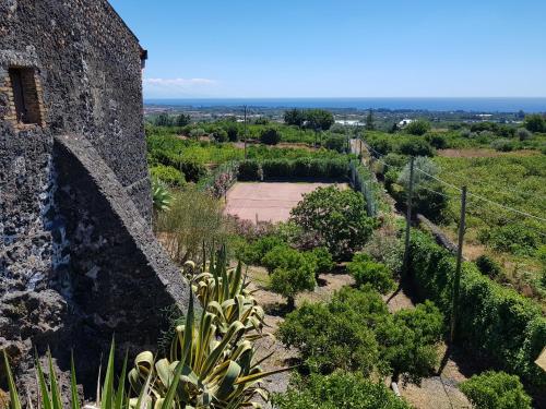 an aerial view of a garden with a stone wall at Agriturismo Le Case Di Civi in Mascali
