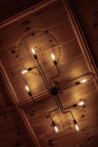 a chandelier hanging from the ceiling of a room at GIRLINGGUT Schlafen Starten Salzburg in Elixhausen