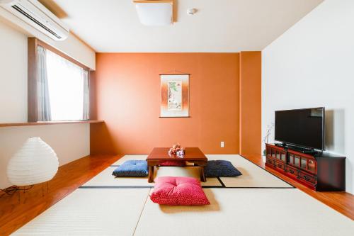 TV a/nebo společenská místnost v ubytování GuestHouse MIYABI