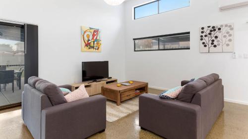 a living room with two couches and a tv at Great Ness Beach House - 8 Person Spa - Pet-Friendly - Netflix - Linen included in Goolwa South