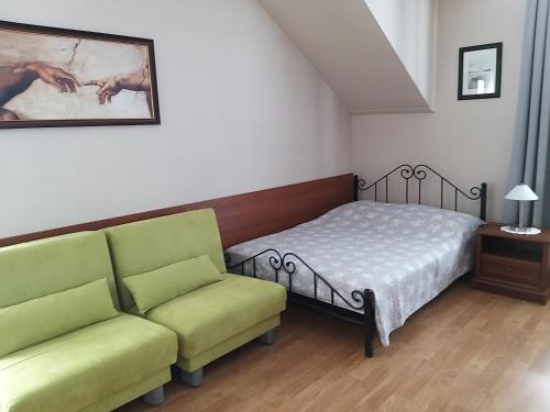 Postel nebo postele na pokoji v ubytování Villa Pod Dębem