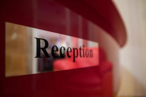 a red sign with the word recederation on it at Accommodation Zara in Vukovar