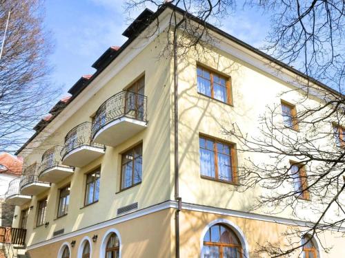 a large white building with many windows on it at Hotel U Brány in Uherský Brod