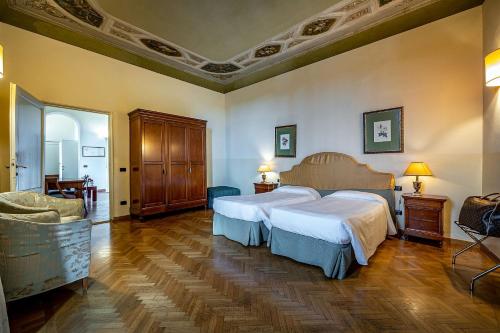 Postel nebo postele na pokoji v ubytování Palazzo Gamba Apartments al Duomo