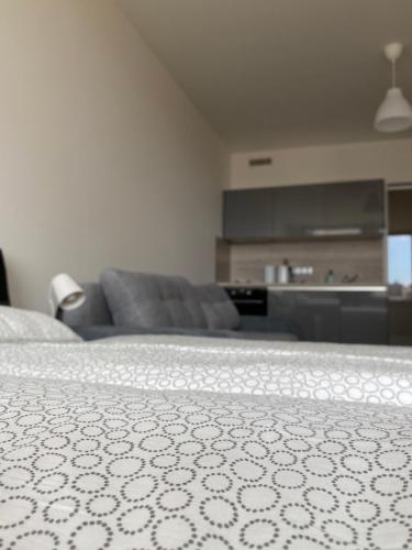 a living room with a couch and a bed at Apartment David O2 Arena Prague in Prague