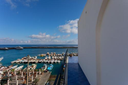a view of a marina from the balcony of a cruise ship at Capri holiday home with a sea view in Capri