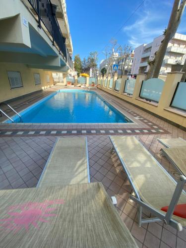 a swimming pool in the middle of a building at Hotel Artide in Rimini