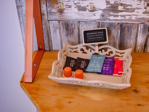 a toy shelf with pillows on a wooden floor at Domaine de la Pommeraye & Spa in La Pommeraye