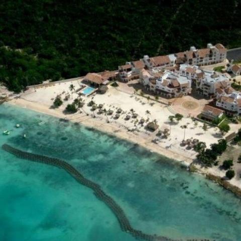 an aerial view of a resort with a pool of water at Appartamenti in Cadaques Caribe in Bayahibe