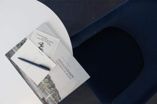a box with a blue envelope with a knife in it at Hotel-Pension Am Fuchsberg in Bad Doberan