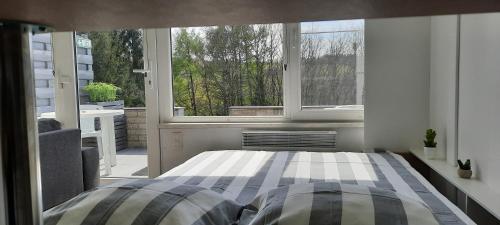 Ένα ή περισσότερα κρεβάτια σε δωμάτιο στο Terrasses de Malmedy M&I