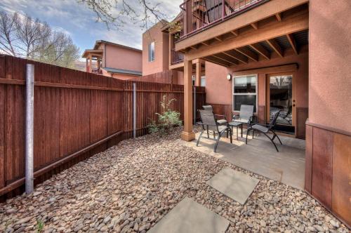 a patio with a fence and a table and chairs at The Gonzo Inn in Moab