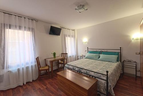 Postel nebo postele na pokoji v ubytování B&B Sognare A Venezia