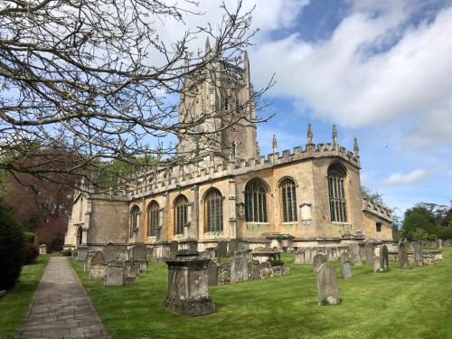 an old church with a tower in a cemetery at Kellsboro Corner in Fairford