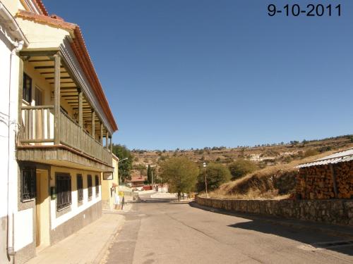 an empty street next to a building on a hill at Apartamento EL BALCON in Cuenca