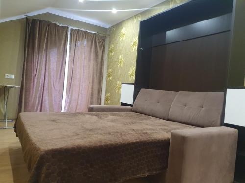 Кровать или кровати в номере Apartment Ivushka