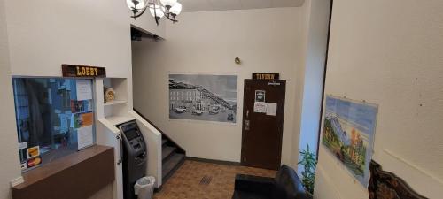 a room with a painting on the wall and a painting on the wall at Cosmopolitan Hotel in Blairmore