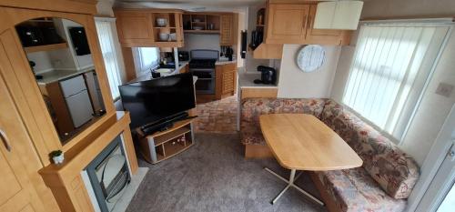 an aerial view of a living room and kitchen in an rv at Staycation Opposite Fantasy Island Ingoldmells in Ingoldmells