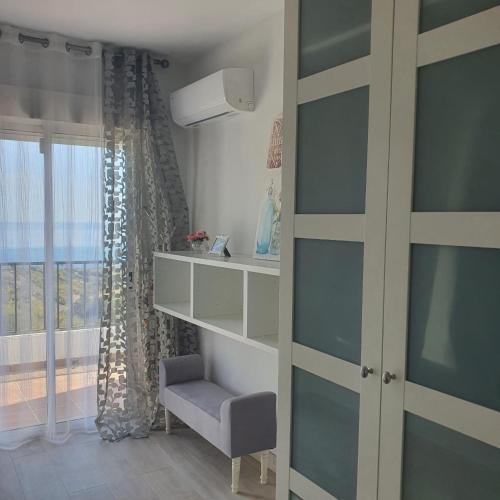 En eller flere senge i et værelse på Niza Beach