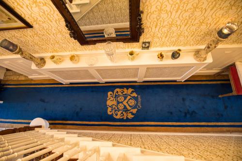 an auditorium with white seats and a mirror on the wall at Bruckless Rest - Fine Country Living in Milltown