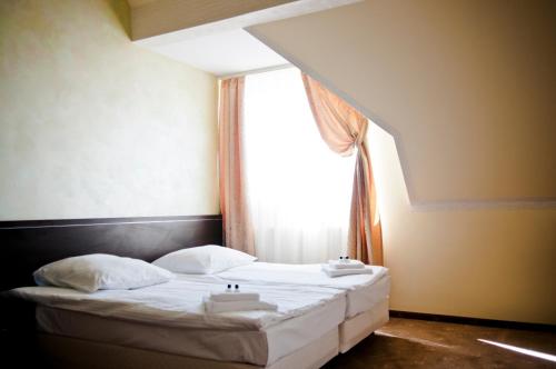 Ένα ή περισσότερα κρεβάτια σε δωμάτιο στο Hotel Oleńka