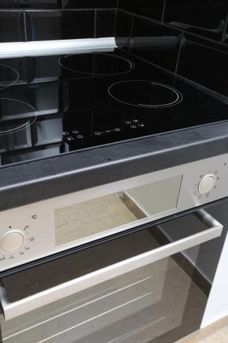 an oven with two burners on top of it at Mare Monte Luxury Apartments 1 in Nea Skioni