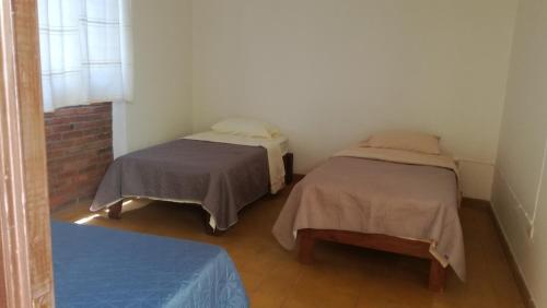 Ένα ή περισσότερα κρεβάτια σε δωμάτιο στο Casa Gaby