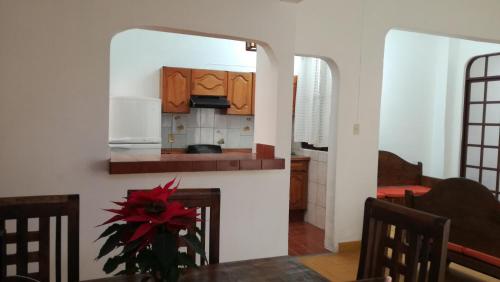 a kitchen and dining room with a table and chairs at Casa Gaby in Morelia