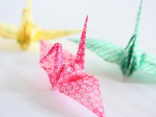 two pink origami umbrellas sitting on a table at APA Hotel Nishifunabashi Ekimae in Funabashi