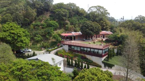 an aerial view of a house on a hill at Jihead Villa in Xinpu