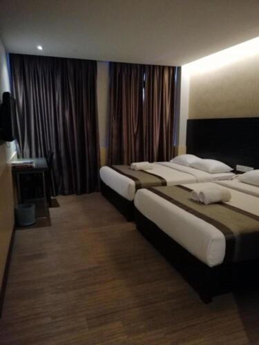 Postel nebo postele na pokoji v ubytování Hotel Austin Paradise
