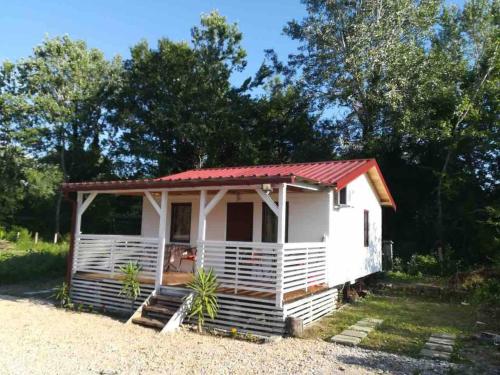 a small white cottage with a red roof at Rajana Bungalow - Ulcinj in Ulcinj