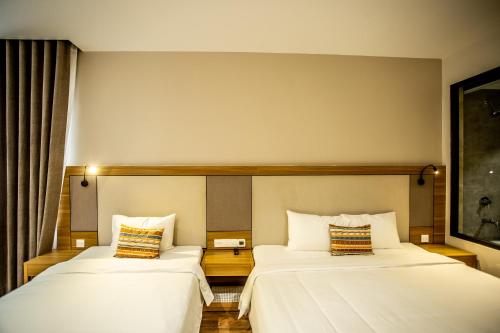 Letto o letti in una camera di Thanh Mai Hotel