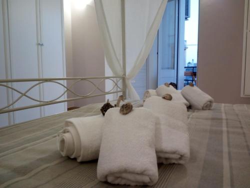 a hotel room with white towels on a bed at Palazzo Mosca in Sannicola