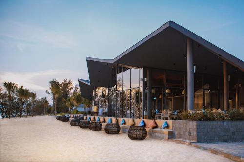 a building with a row of seats in front of it at Crowne Plaza Phu Quoc Starbay by IHG in Phu Quoc